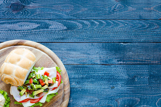 istock Fresh and tasty sandwich with ham and vegetables 618754218