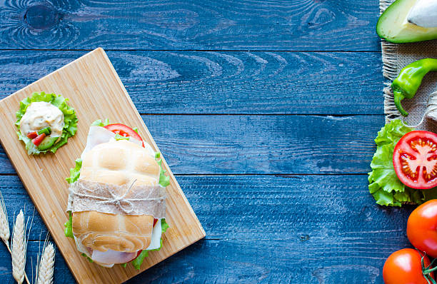 istock Fresh and tasty sandwich with ham and vegetables 618754314