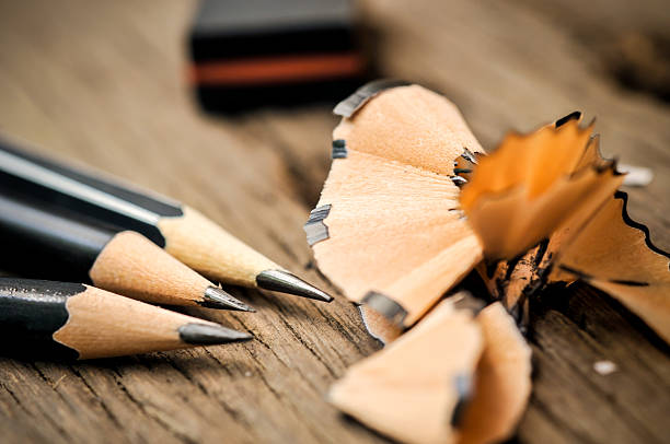 istock Pencil after shavings on wooden table 618756316