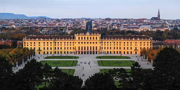 Vienna, Austria - October 27, 2015: Schonbrunn Palace is a former imperial summer residence located in Vienna, Austria. The famous Baroque palace is one of the most important architectural, cultural, and historical monuments in the country. Today, it is a museum and a popular tourist attraction. The history of the palace and its vast gardens spans over 300 years, reflecting the changing tastes, interests, and aspirations of successive Habsburg monarchs.