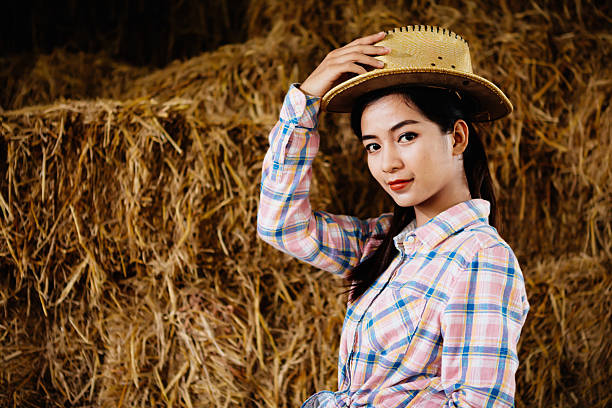 istock Cute girl on hay field 618758156