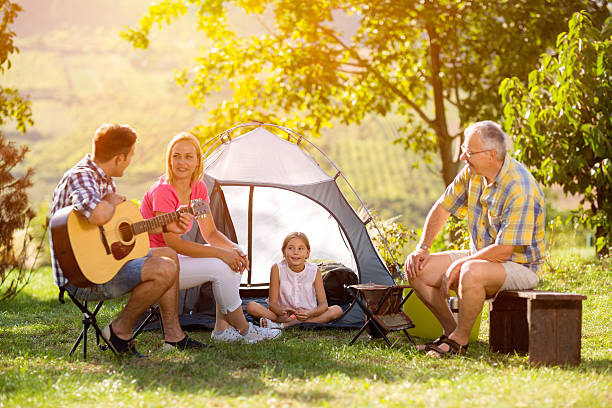 istock Family camping in the countryside 618758192