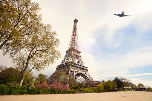 Travel to Paris. View of Eiffel Tower and airplane.