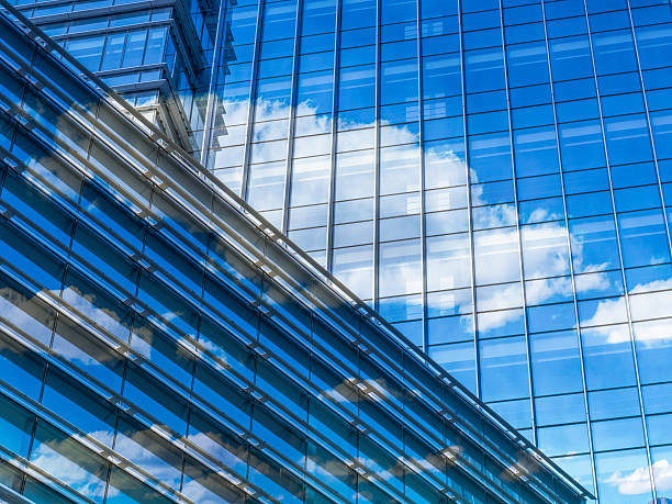 istock modern glass building with clouds and sky reflections 618759518