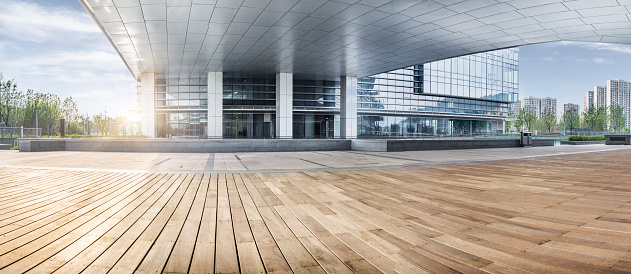 office building entrance with wooden floor foreground,china.
