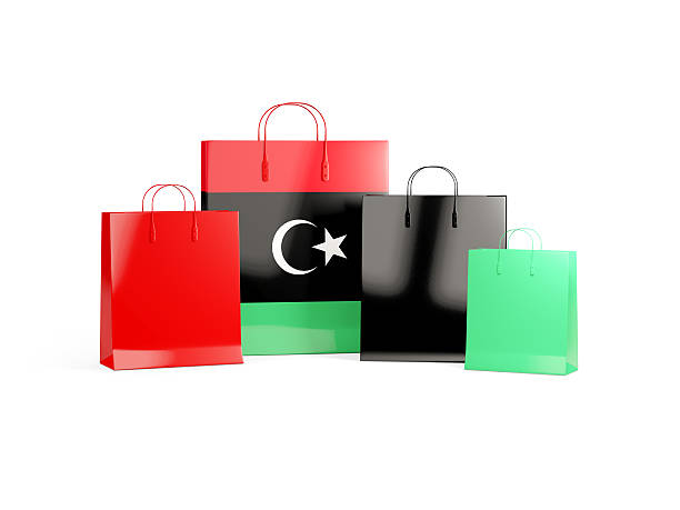 flagge von libyen auf einkaufstaschen - libya flag libyan flag three dimensional shape stock-fotos und bilder