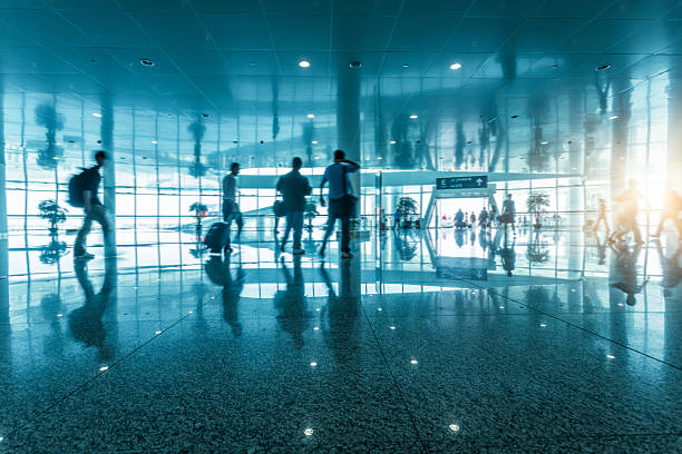 istock passengers walking in airport interior,shanghai. 618761520