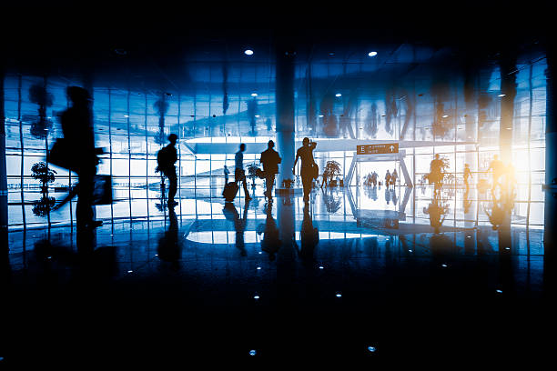 istock passengers walking in airport interior,shanghai. 618761532