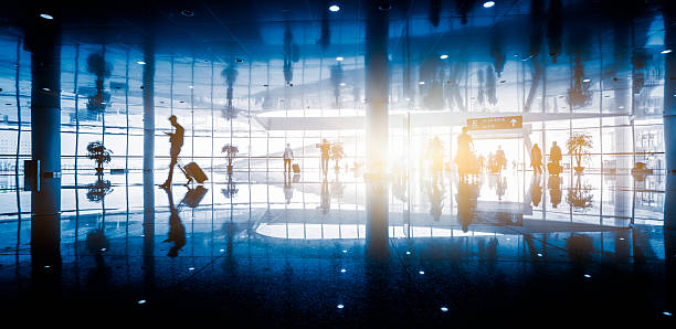 istock passengers walking in airport interior,shanghai. 618761548