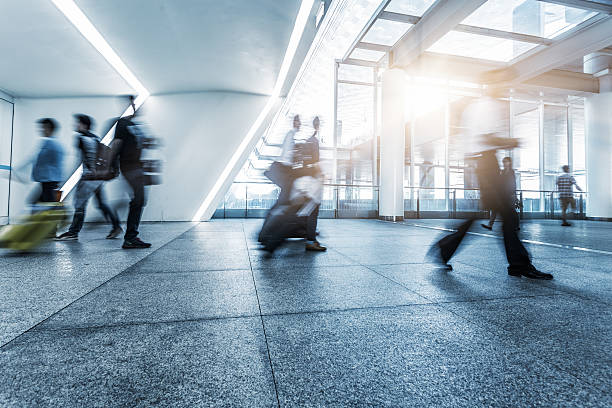 istock passengers walking in airport interior,shanghai. 618761678