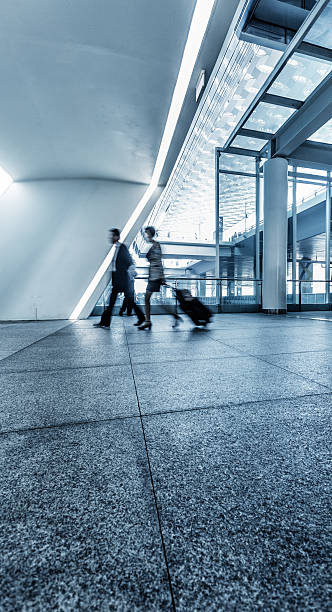 istock passengers walking in airport interior,shanghai. 618761796