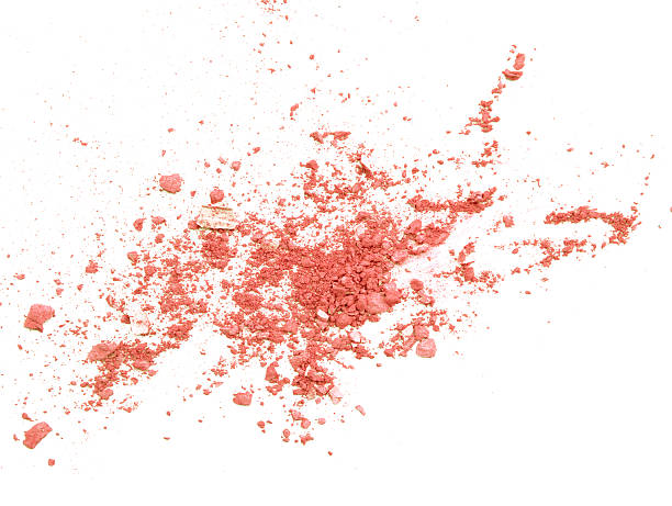 istock Orange eyeshadow crushed on white close up for background 618762328