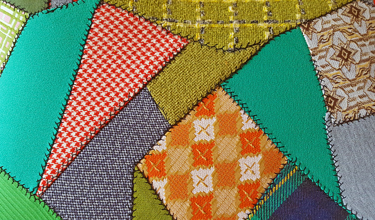 close up of crazy patchwork quilt design with retro fabric