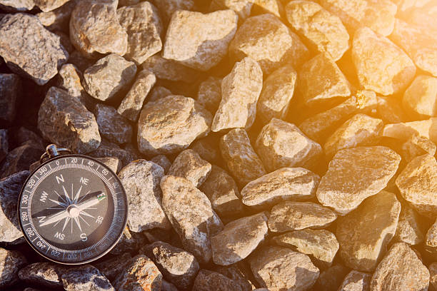istock compass on the bank with sunflare 618764080
