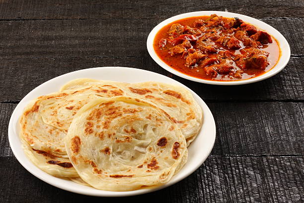 Asian flat bread paratha with meat curry Spicy and tasty Asian flat bread paratha with meat curry taftan stock pictures, royalty-free photos & images