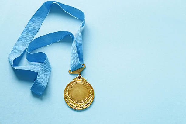 リボン付きの金メダル。 - gold medal medal ribbon trophy ストックフォトと画像