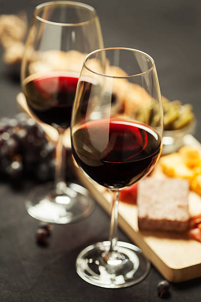 istock Red wine with charcuterie assortment on the background 618765468