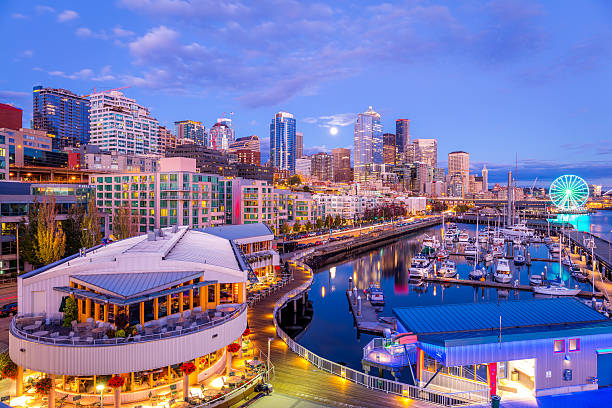 seattle por la noche. hermosos rascacielos. colores brillantes. - seattle night skyline architecture and buildings fotografías e imágenes de stock