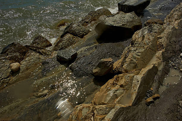 istock Wet sea rocks, washed by the waves. 618766178