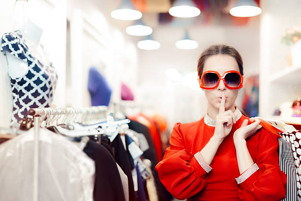 Shopping with Big Sunglasses Woman Keeping a Secret Cool mysterious girl with shopping bags undercover mystery stock pictures, royalty-free photos & images