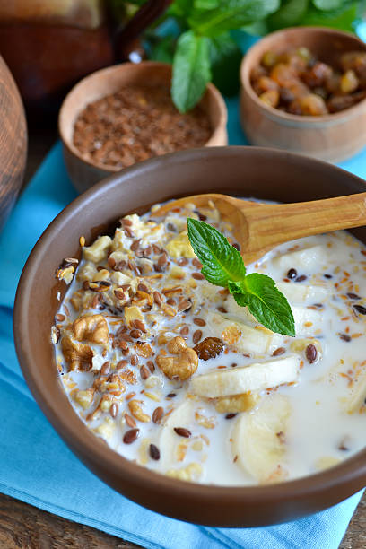 istock Granola with milk, walnuts and a banana for breakfast 618830910