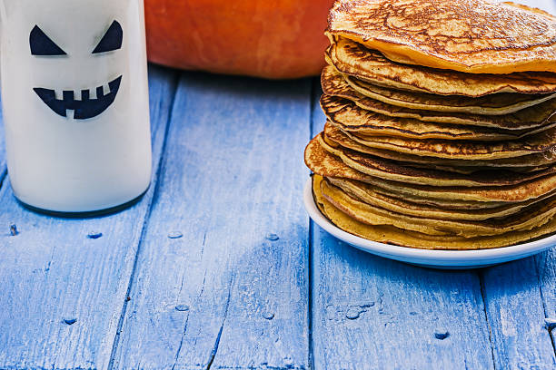 istock Pumpkin pancakes and boo milk bottle 618832360