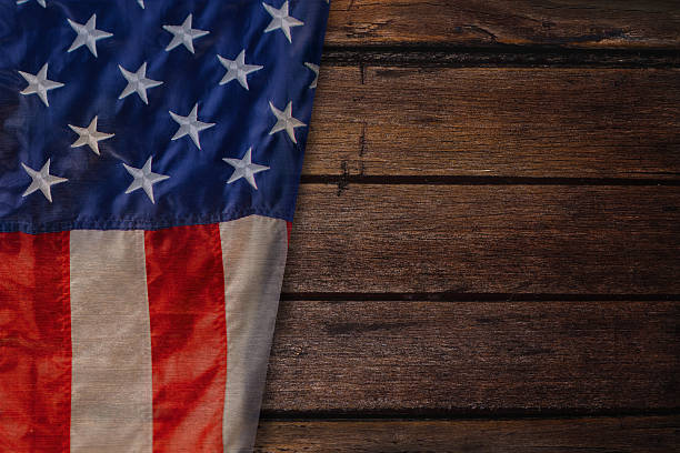istock Vintage American flag on a antique wooden platform 618835064