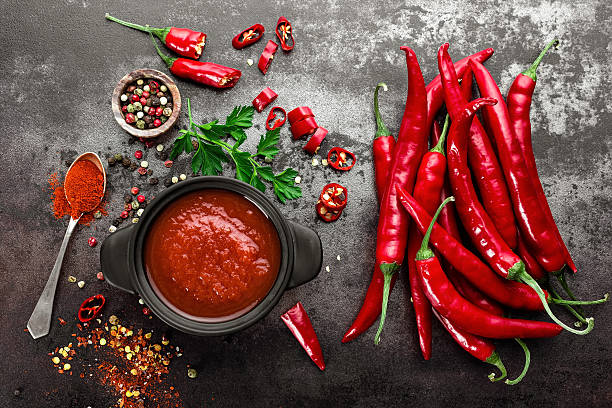 spicy chili sauce, ketchup spicy chili sauce, ketchup chilli pepper stock pictures, royalty-free photos & images