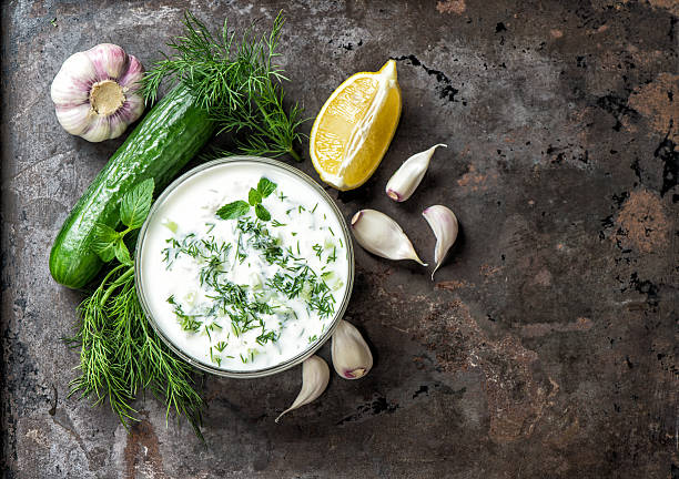 tzatziki sauce ingredients cucumber, garlic, dill food background - yogurt greek culture milk healthy eating imagens e fotografias de stock