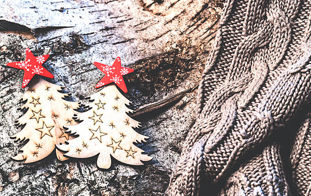 istock Christmas ornaments are located on a tree bark 618838398