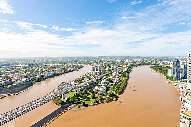istock Hard bridge with buildings and green gardens. 618839258