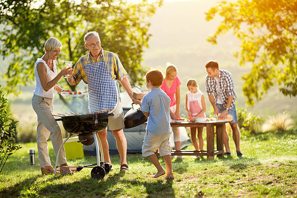 istock grandson helps grandparents to make a barbecue 618839940