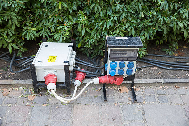 istock Electric switchboard is in the bushes. And thick cables connected 618839944