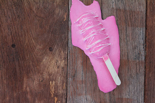 Melting ice cream on old wood stock photo