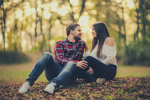 istock Cheerful couple having fun together during autumn day 618840758