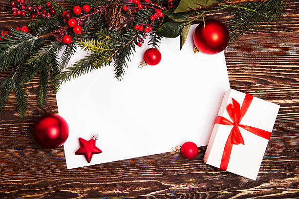 istock Christmas greeting card or photo frame over wooden table. 618841166