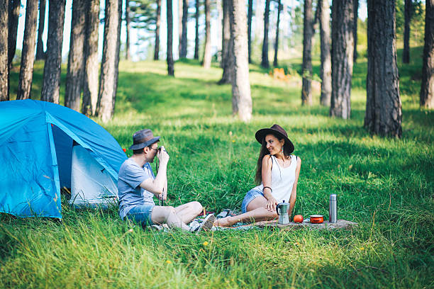 istock Young photographer couple camping 618841342