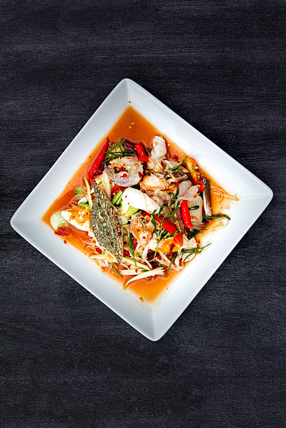 istock Green Papaya Salad (Som tum Thai) with seafood, Top view 618841704