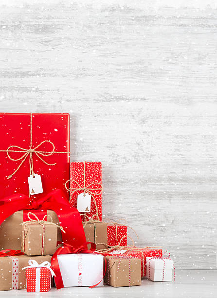 istock Heap of Christmas Gift Boxes on Wooden Table 618841948