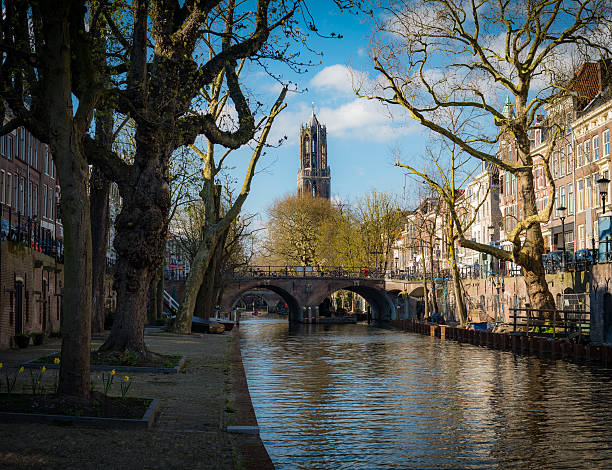 sunny winterday canals in dutch utrecht with view on dom - utrecht stockfoto's en -beelden