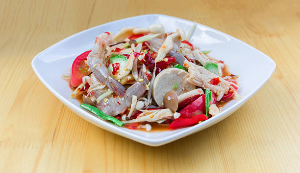 istock Green Papaya Salad (Som tum Thai) mixed with seafood 618842132