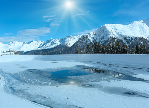 Winter sunshiny mountain landscape with lake. Kappl ski region in the Tyrolean mountains, Austria.