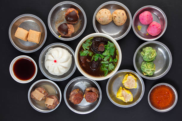 istock Aerial View of Various Yumcha Dimsum Set on black background 618843474