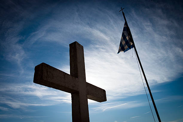 istock Low Angle View Of Cross Against Blue Sky 618845584