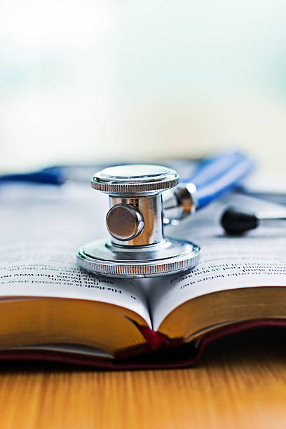 istock Medical stethoscope on a book 618847200