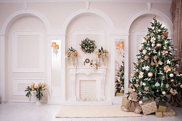 istock Majestic white hall with classical fireplace at Christmas 618847502