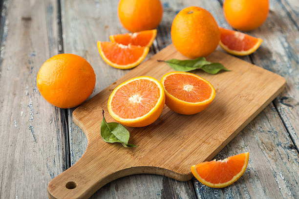 orange isolated on wood background stock photo