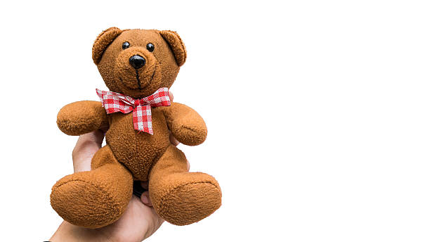 istock Hand holding teddy bear on white background, Clipping-path 618849416