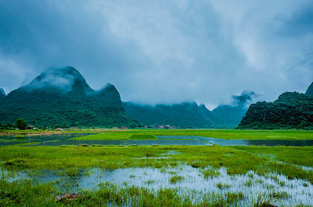 istock Karst mountains and rural scenery in the mist 618850026