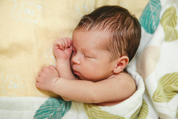istock Small Baby is Slipping.Sweat Dreams.Cute Look.Selective Focus 618850110